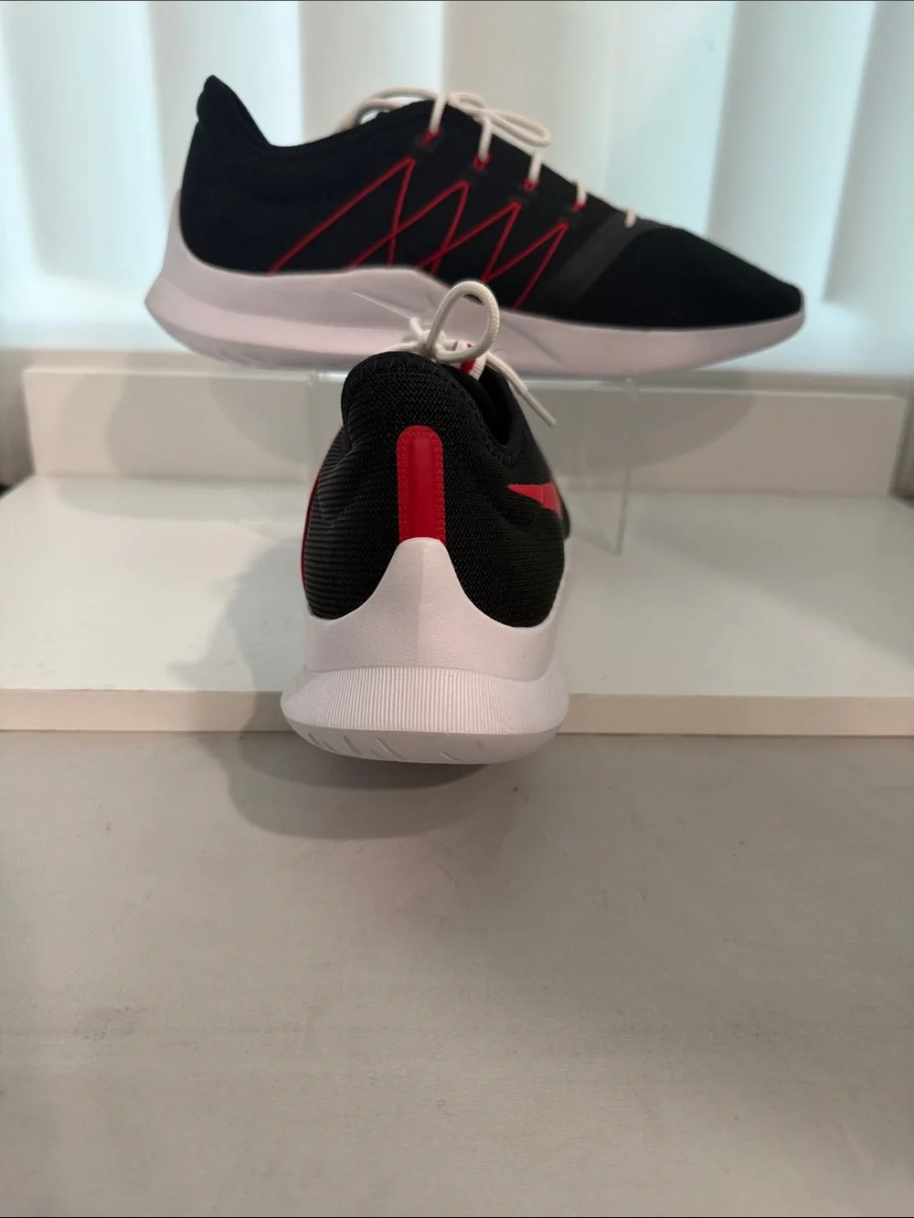 Nike Men's Black Athletic Shoes with Red Swoosh and White Sole